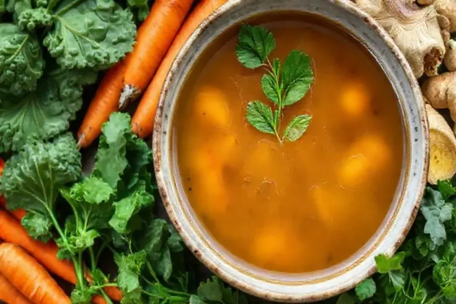 Healthy detox broth with fresh vegetable ingredients for a revitalizing meal.