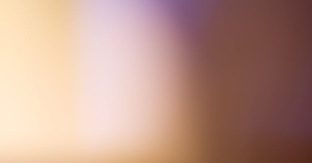 A soothing abstract blurred gradient background with warm tones.