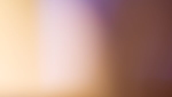 A soothing abstract blurred gradient background with warm tones.