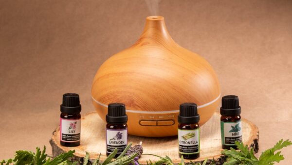 Wooden diffuser with essential oils, perfect for relaxation and aromatherapy needs.