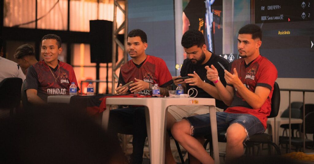 Como a Criatividade Pode Ajudar na Superação de Desafios Emocionais 2 A group of e-sports players participating in a gaming event, focused on smartphone gameplay.
