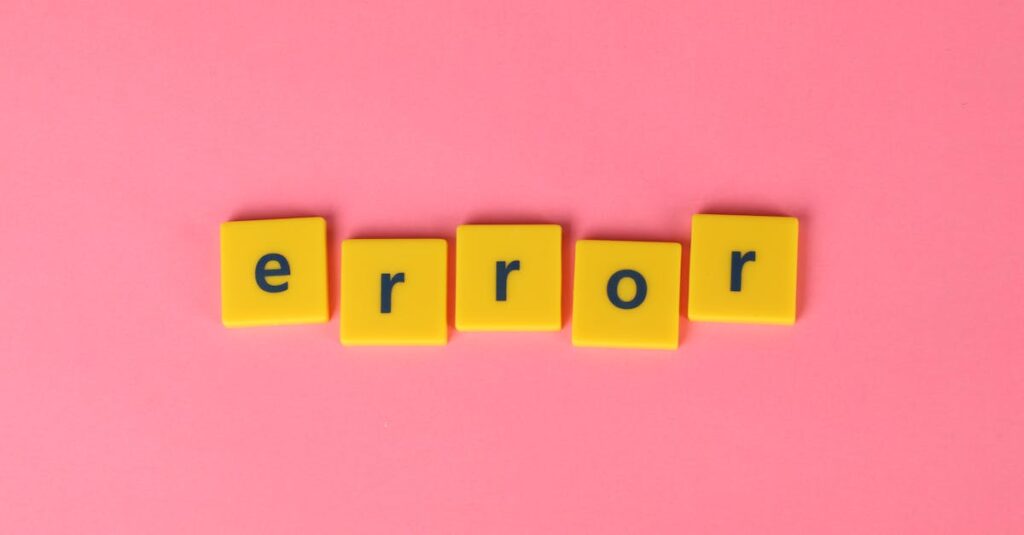 Yellow block letters spelling 'error' on a vibrant pink background, capturing a playful message.