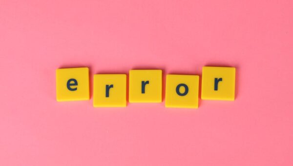 Yellow block letters spelling 'error' on a vibrant pink background, capturing a playful message.