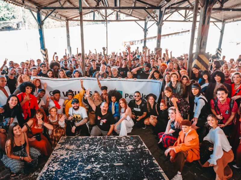 Vibrant group photo in a warehouse in Rio de Janeiro showcasing diversity and togetherness.