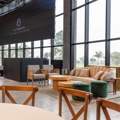 Spacious conference hall featuring modern furniture and large windows with a scenic outdoor view.