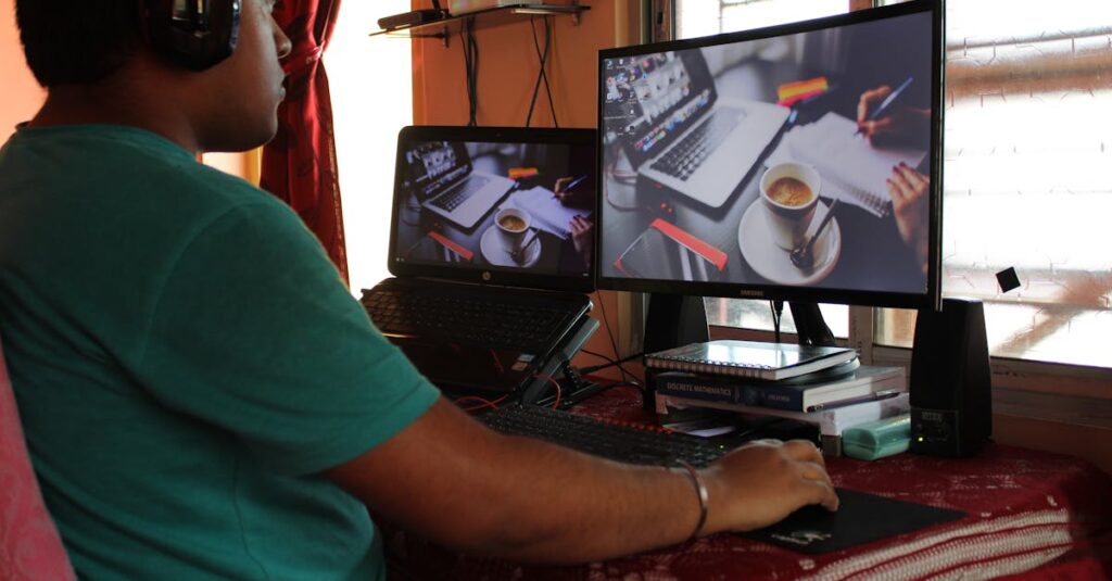 A person working from home in Kolkata with dual monitors, coffee, and headphones. Ideal for remote work concepts.