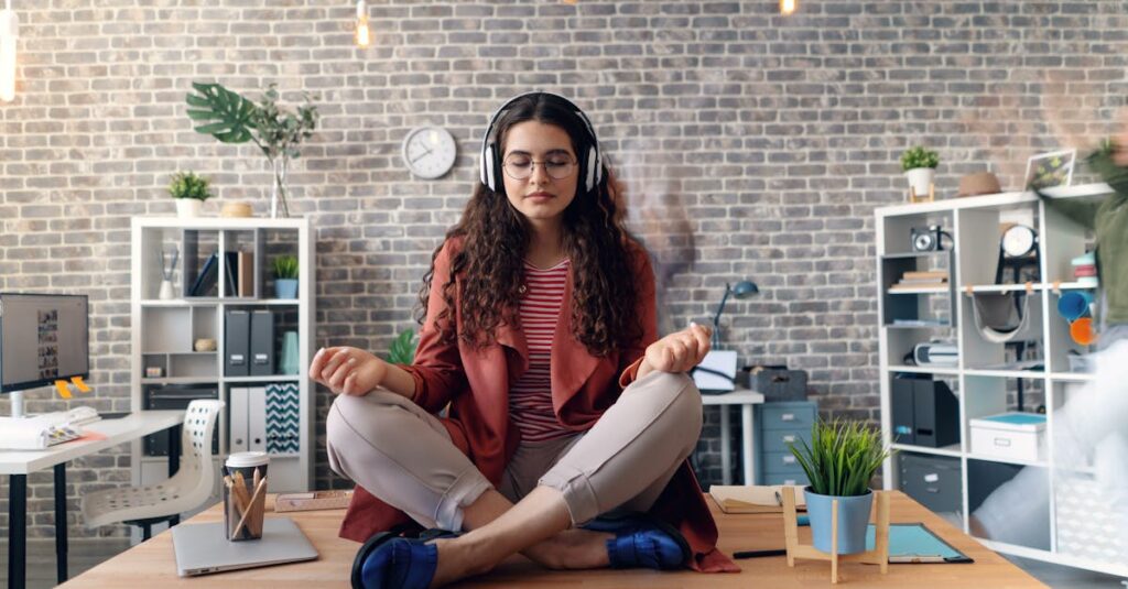 Young woman meditating with headphones in a modern office setting, practicing mindfulness.