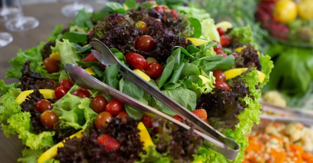 Vibrant mixed green salad with cherry tomatoes and fresh vegetables, perfect for a healthy meal.