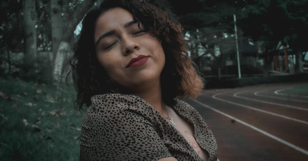 Portrait of a serene woman with curly hair, enjoying autumn in a Huatusco park.