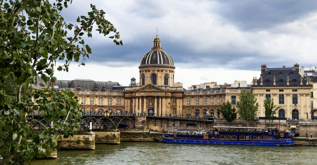 Capture of the iconic Pont des Arts and Institut de France along the Seine River in Paris.