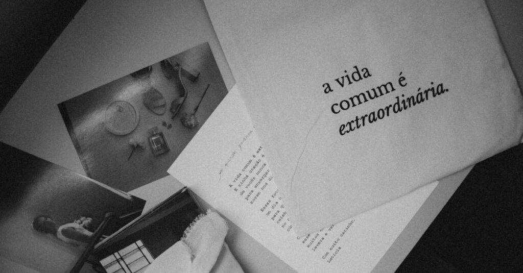 Monochrome still life featuring Portuguese text 'a vida comum é extraordinária' on paper.