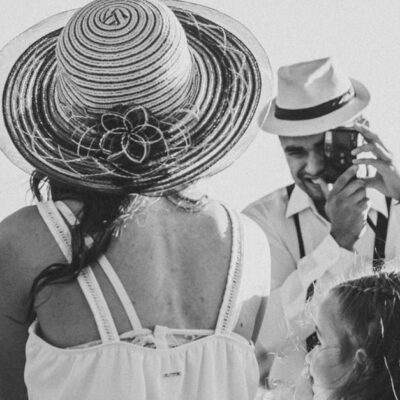 A black and white family portrait of a couple and child overlooking Sorocaba, Brazil on a sunny day.