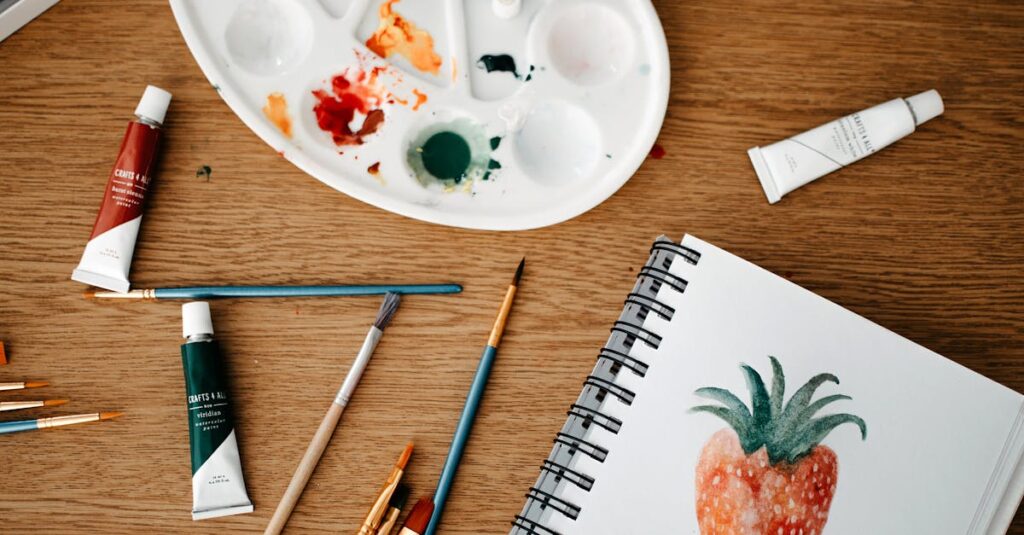 Explore a vibrant creative art space with watercolors and brushes on a wooden desk.