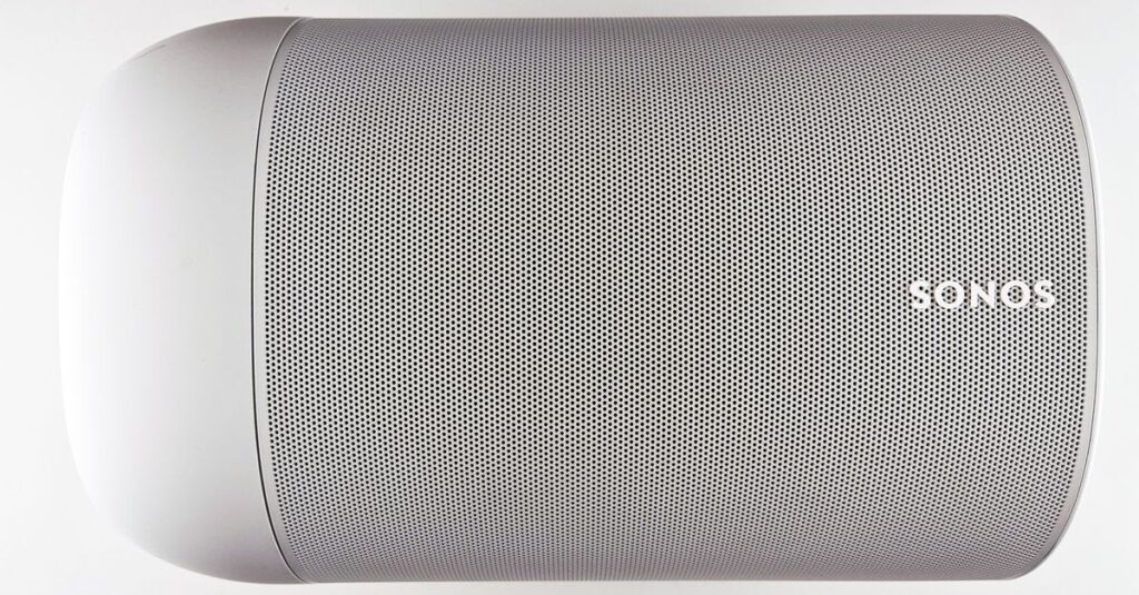 Top view of a sleek wireless speaker with a minimalistic design.