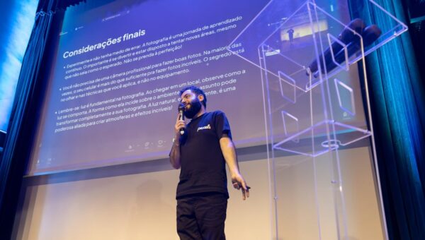A speaker engages the audience during a conference presentation.