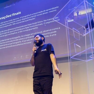 A speaker engages the audience during a conference presentation.