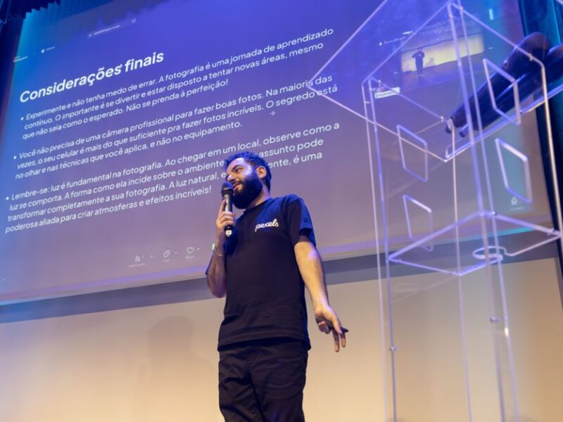 A speaker engages the audience during a conference presentation.
