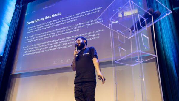 A speaker engages the audience during a conference presentation.