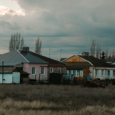 Quiet rural scene with houses under a cloudy sky in Semennoi, Saratov Oblast, Russia.