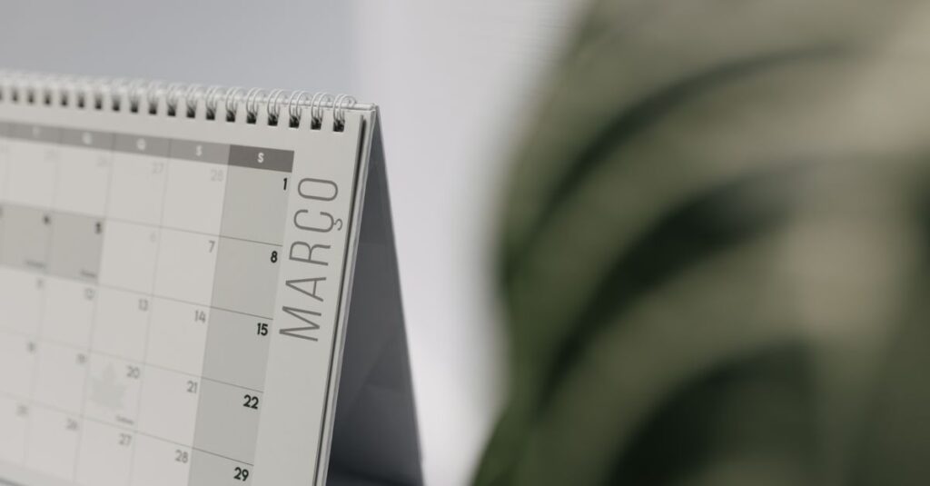 A close-up shot of a desk calendar open on March, with a soft, minimalistic background.