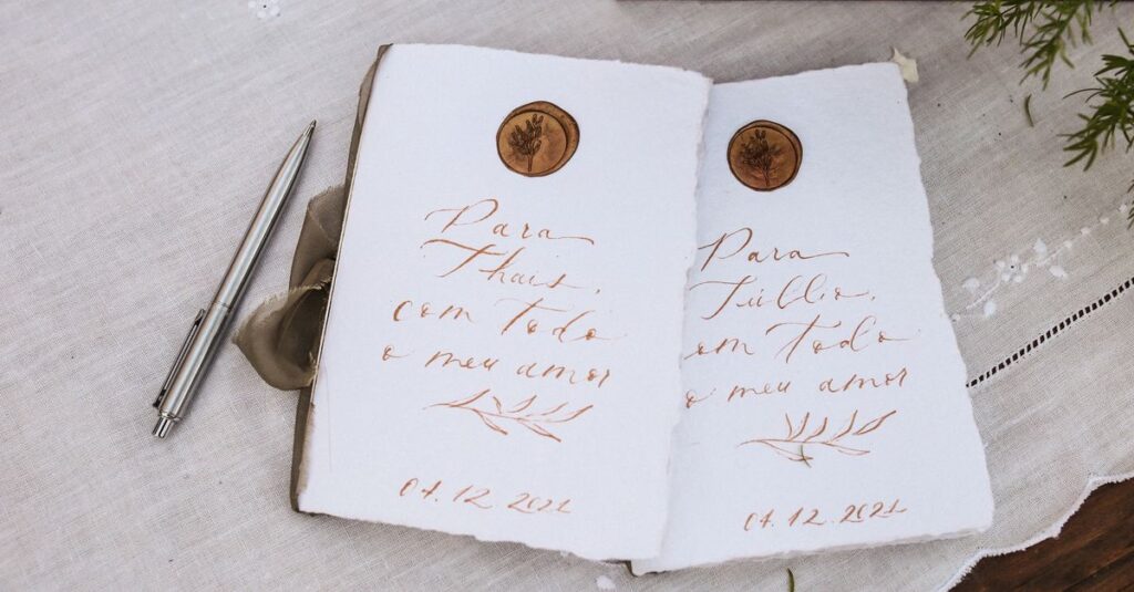 A beautiful handwritten note with wax seal on textured paper, ideal for weddings or invitations.