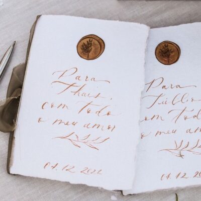 A beautiful handwritten note with wax seal on textured paper, ideal for weddings or invitations.