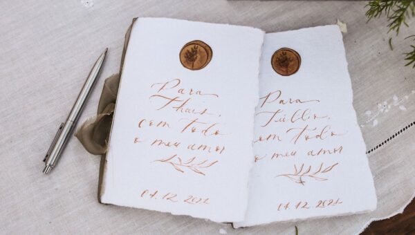 A beautiful handwritten note with wax seal on textured paper, ideal for weddings or invitations.