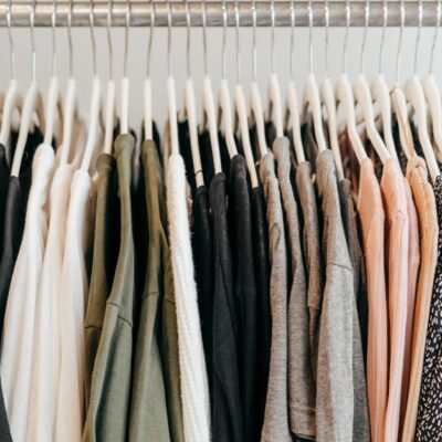 Neatly arranged clothing on hangers showcasing a variety of fabrics and styles.