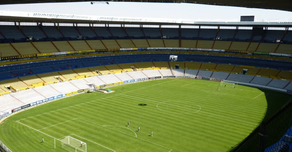 Spacious soccer stadium with green field in Jalisco del Refugio, Mexico.