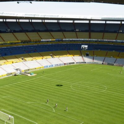 Spacious soccer stadium with green field in Jalisco del Refugio, Mexico.