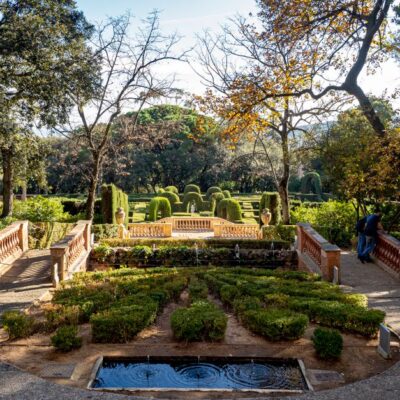 Explore the tranquil beauty of Parc del Laberint d'Horta in Barcelona, showcasing its elegant topiary and sunlit pathways.
