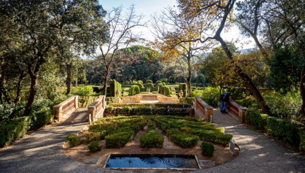 Explore the tranquil beauty of Parc del Laberint d'Horta in Barcelona, showcasing its elegant topiary and sunlit pathways.