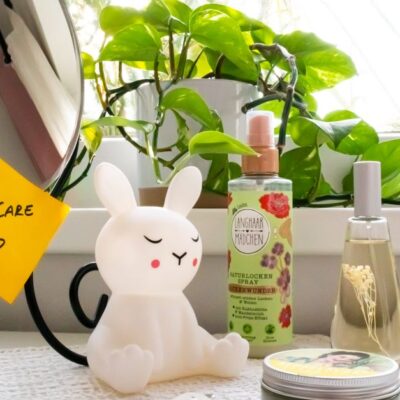 A soothing self-care corner with a bunny lamp, cosmetics, and a mirror, perfect for a relaxing routine.